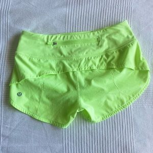 Speed Up Low-Rise Lined Short 2.5" Size 2, color is highlighter greenish-yellow